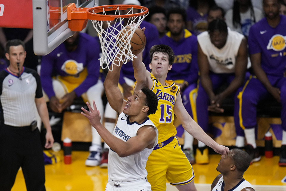 <strong>Los Angeles Lakers' Austin Reaves (15) blocks a shot by Memphis Grizzlies' Desmond Bane during the first half in Game 6 of a first-round NBA basketball playoff series Friday, April 28, 2023, in Los Angeles.</strong> (AP Photo/Jae C. Hong)