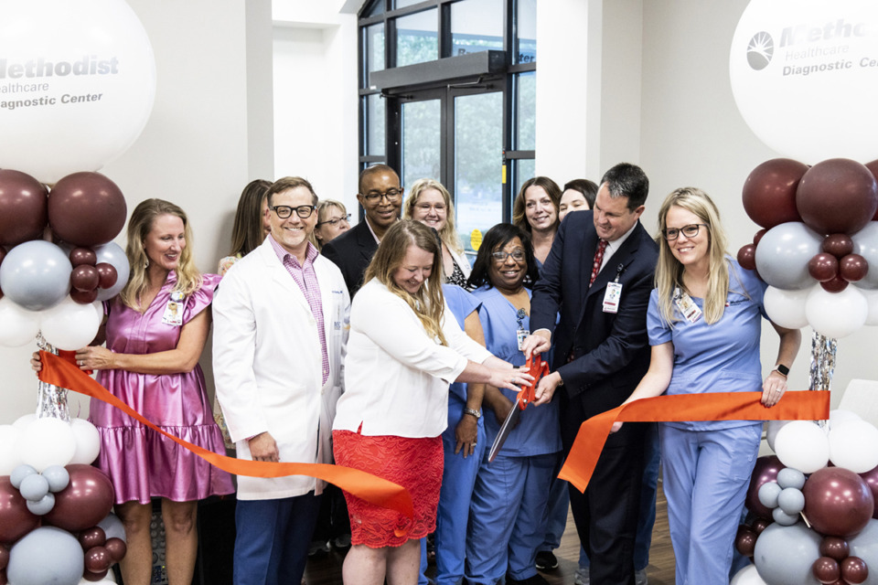 <strong>Methodist Healthcare employees cut the ribbon on its newly renovated comprehensive breast center. For the first time, this center will include clinical areas for breast surgeons &mdash; so patients can receive comprehensive care in one location.</strong> (Brad Vest/Special to The Daily Memphian)