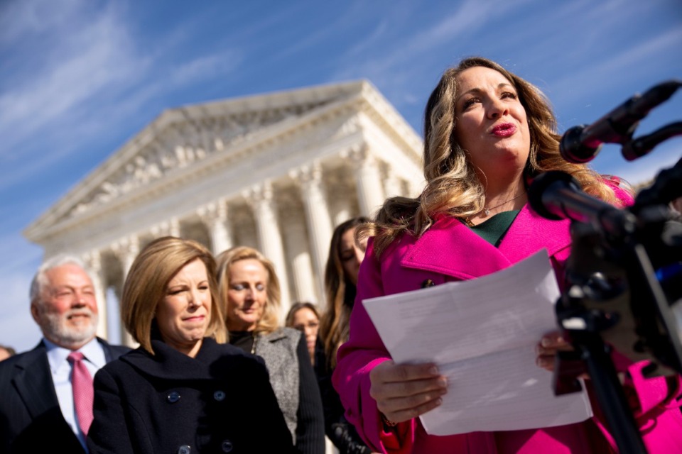 <strong>Lorie Smith. (right), a Colorado graphic artist, with her attorney, Kristen Waggoner (second from left), speaks outside the Supreme Court in Washington. The court ruled Friday, June 30, 2023, that Smith, who wants to design wedding websites, can refuse to work with same-sex couples.</strong> (Andrew Harnik/AP file)