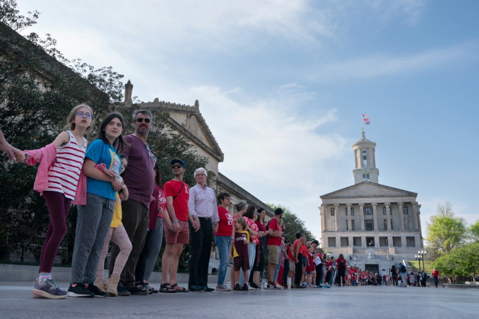 <strong>Demonstrators hold hands and lock arms with each other during the "Arms Are for Hugging" protest for gun control legislation, April 18, 2023, in Nashville, Tenn.</strong> (George Walker IV/AP file)