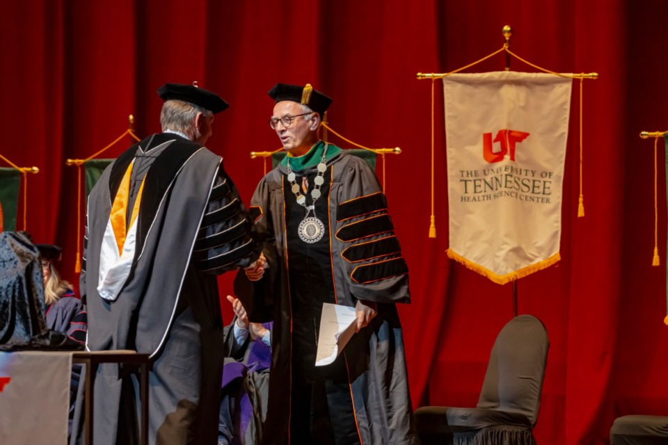 <strong>University of Tennessee System President Randy Boyd (left) shakes hands with Dr. Peter Buckley as University of Tennessee Health Science Center chancellor at the investiture ceremony Nov. 4. 2022.</strong> (Ziggy Mack/Special to The Daily Memphian)