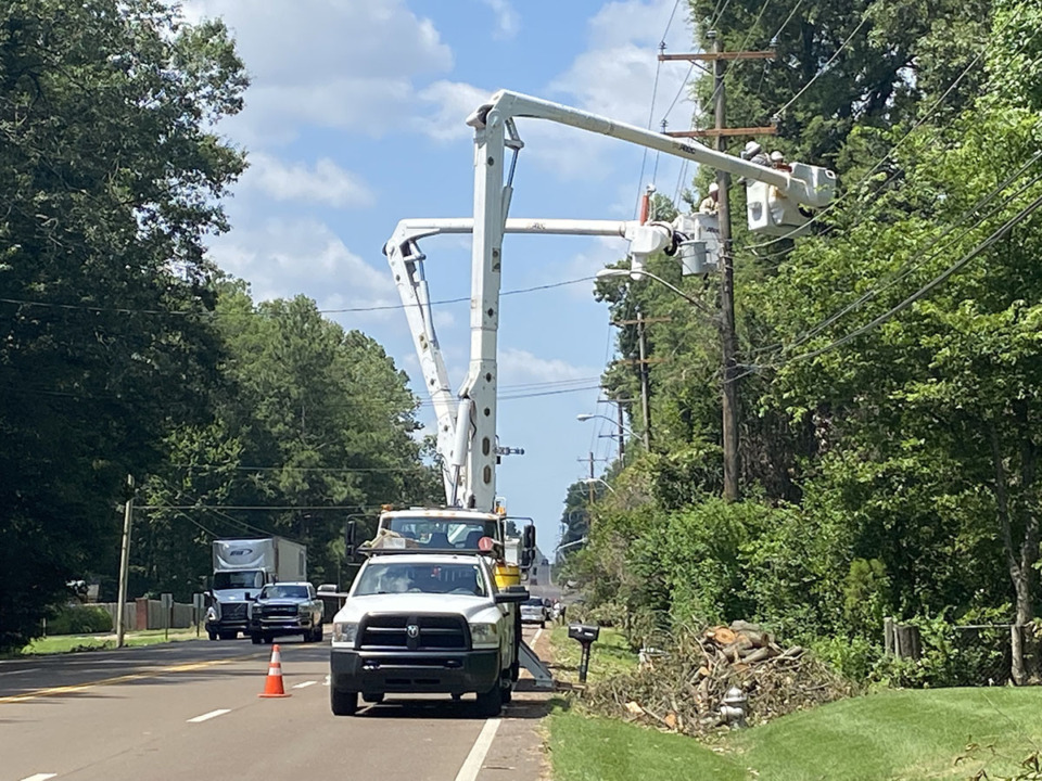 <strong>Standard Electric crews repair power lines on U.S. 70 in Bartlett June 29.</strong> (Michael Waddell/Special to The Daily Memphian)