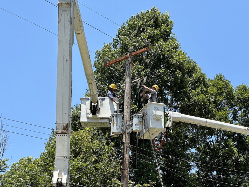 <strong>A Memphis Light, Gas and Water crew works on a damaged utility pole Thursday, June 29. More severe weather is forecast for the Memphis area this week.</strong> (Keely Brewer/The Daily Memphian)