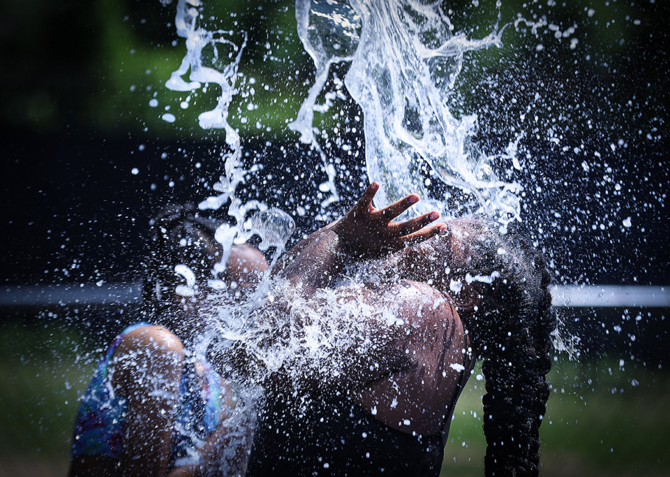 <strong>Kids from the Memphis Parks summer camp play in the new splash pad at Hollywood Community Center July 5.</strong> (Patrick Lantrip/The Daily Memphian)