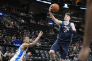 <strong>Memphis Grizzlies forward Jake LaRavia (3) goes to the basket as Oklahoma City Thunder guard Tre Mann defends during a summer league game Wednesday, July 5, 2023, in Salt Lake City.</strong> (Rick Bowmer/AP)