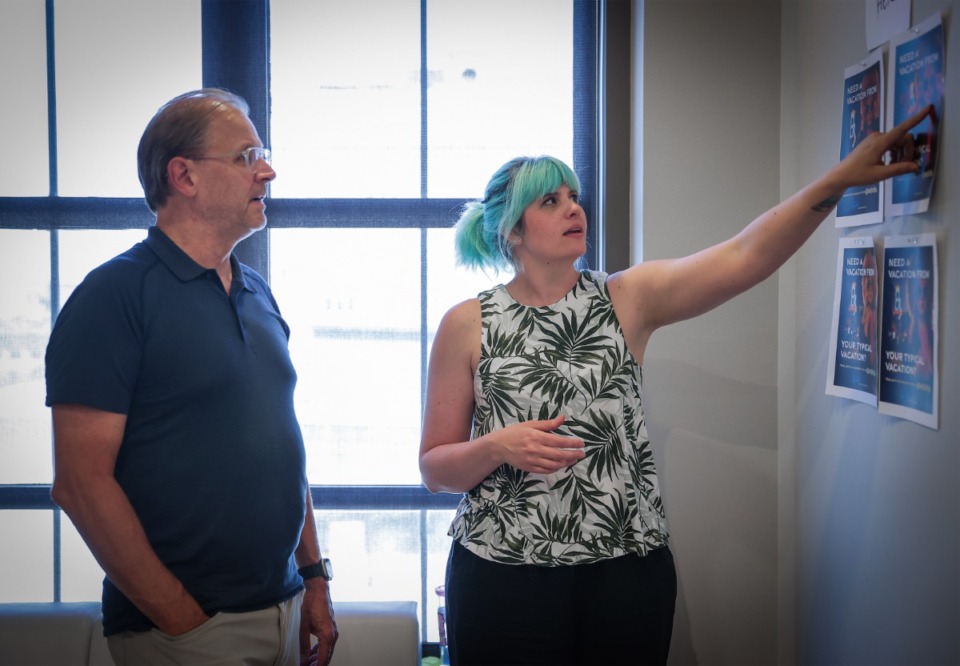 <strong>Richard Williams and Laurel Amatengelo go over promotional material at Archer's Downtown Memphis office June 27.</strong> (Patrick Lantrip/The Daily Memphian)