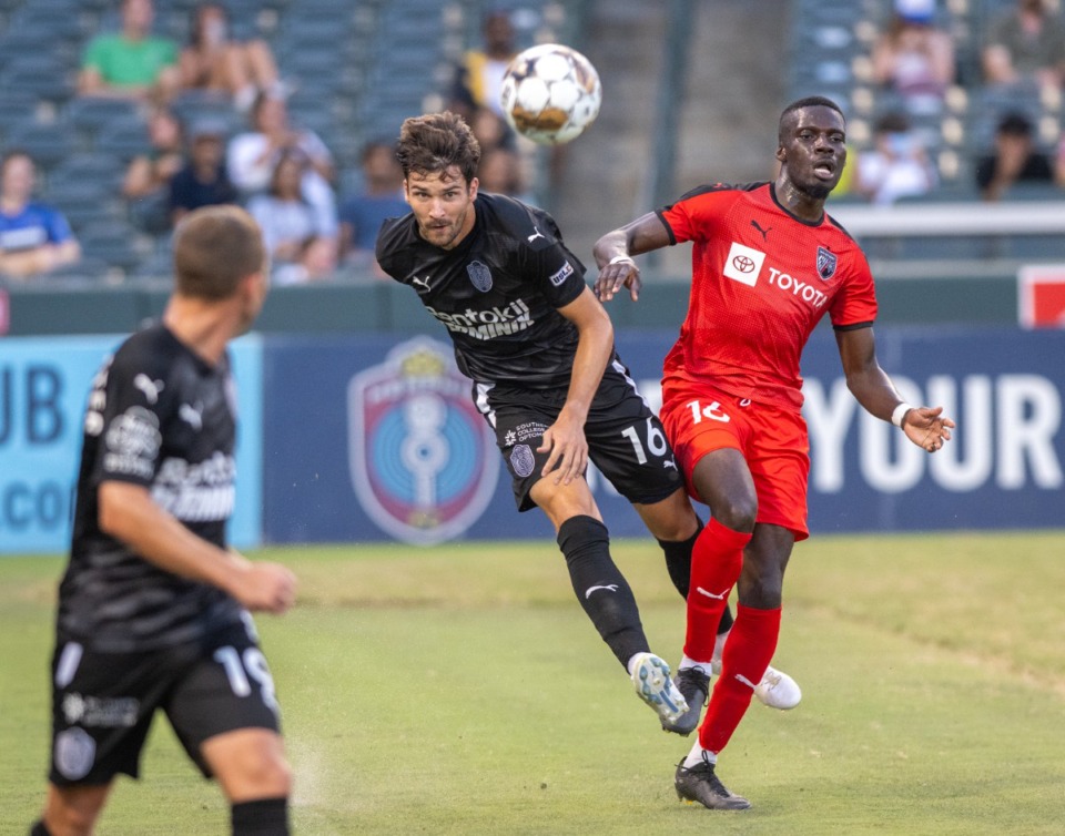 <strong>901 FC's Graham Smith battles for control of the ball with San Antonio's Toni Oluwaseyi at Autozone Park, Friday, July 7, 2023. San Antonio blanked 901 FC 4-0. (</strong>Greg Campbell/Special to The Daily Memphian)