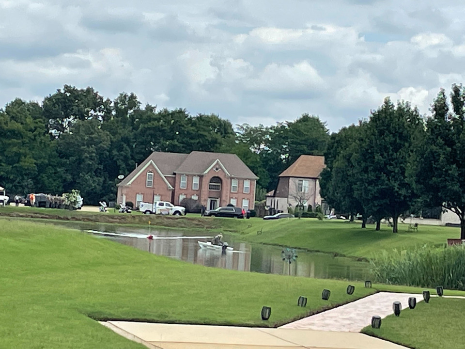 <strong>Law enforcement officers combed combing the Laurel Tree subdivision and Jamieson Lake Friday, July 8.</strong> (Julia Baker/The Daily Memphian)