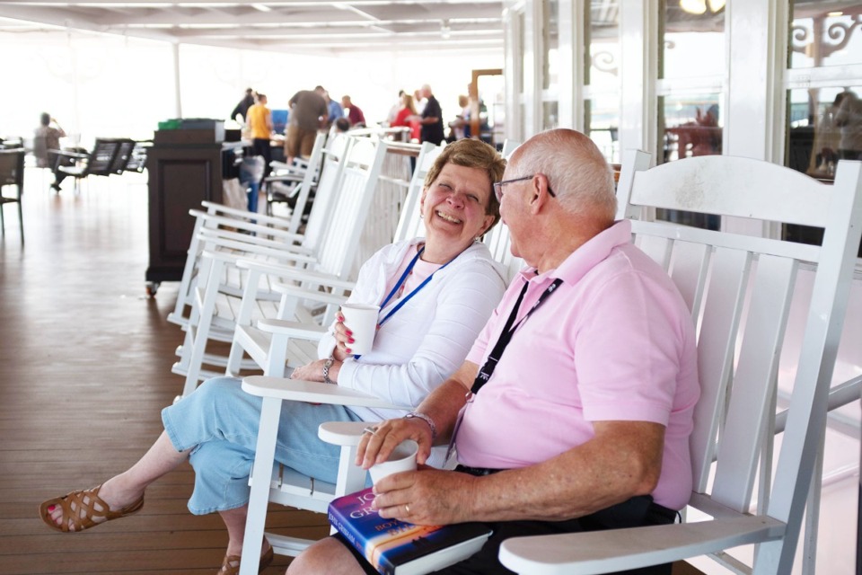 <strong>A couple watches the Mississippi River pass by from the American Queen&rsquo;s Front Porch Cafe May 28.</strong> (Keely Brewer/The Daily Memphian file)
