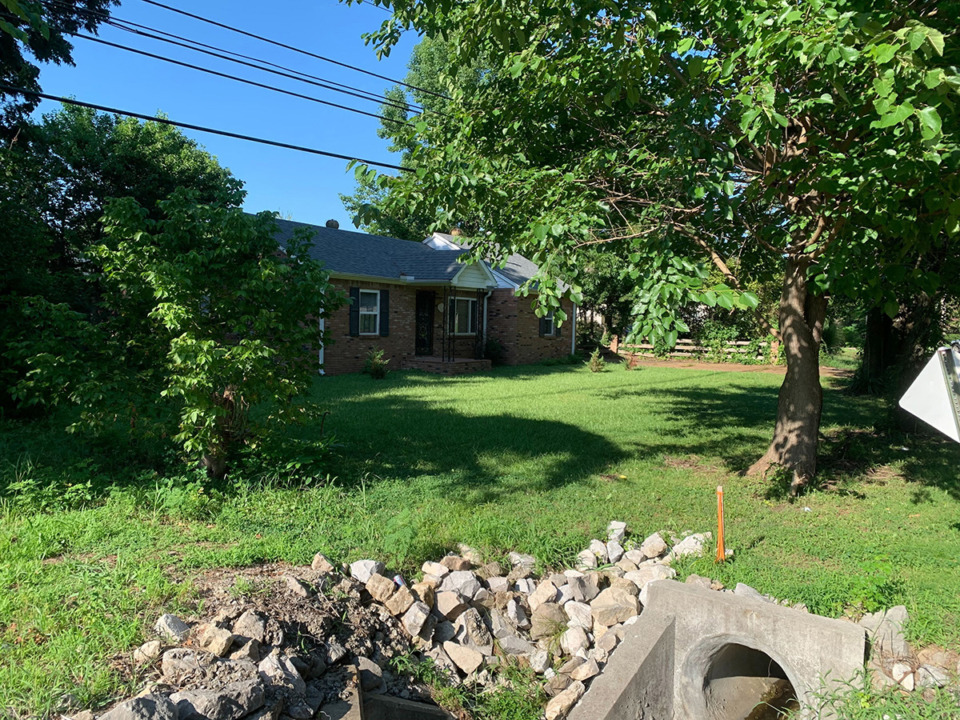 <strong>A home sits on a tract of land on the north side of Poplar Pike and east of Forest Hill Irene Road. The home is surrounded by commercial zoning, but plans are in the works to make the land fit alongside the neighboring area.</strong> (Abigail Warren/The Daily Memphian)