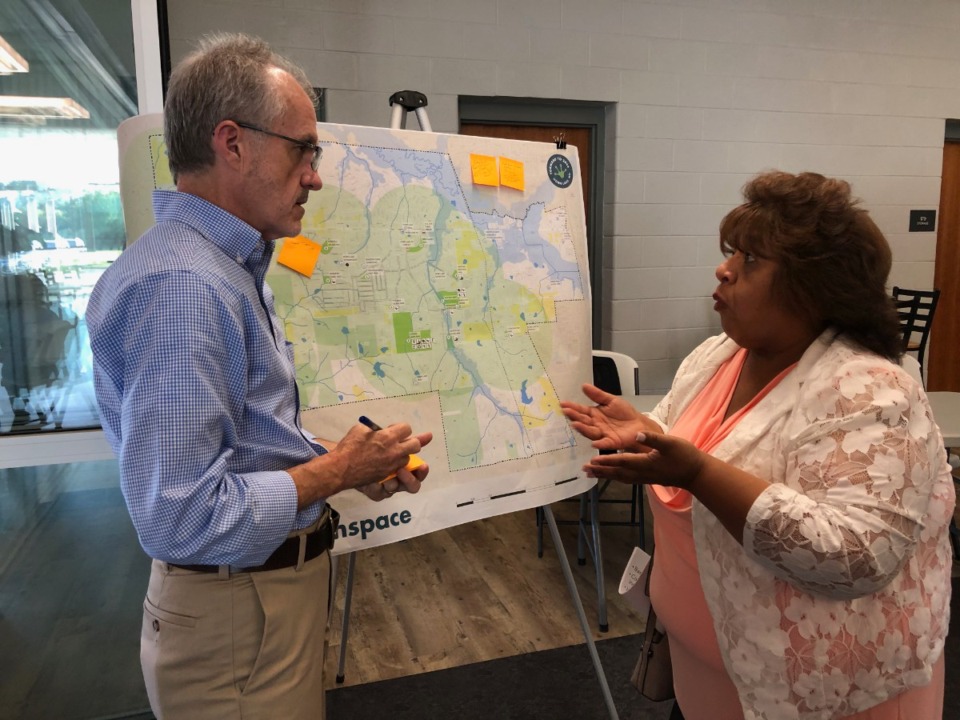 <strong>Orion Planning and Design&rsquo;s Bob Barber (left) takes notes from Horn Lake resident Marta Smally during a comprehensive plan open house on Monday, July 10.</strong> (Beth Sullivan/The Daily Memphian)