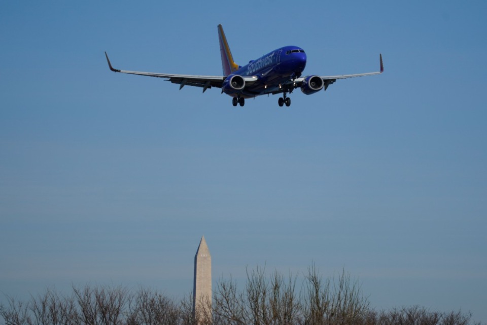 <strong>A Southwest Airlines plane flies low over Gravelly Point, with the Washington Monument in the distance, on approach to Ronald Reagan Washington National Airport in Arlington, Va., Friday, Dec. 30, 2022.</strong>&nbsp;<strong>Southwest has launched its seasonal daily nonstop service between Memphis and Washington, D.C.</strong> (Carolyn Kaster/AP File)