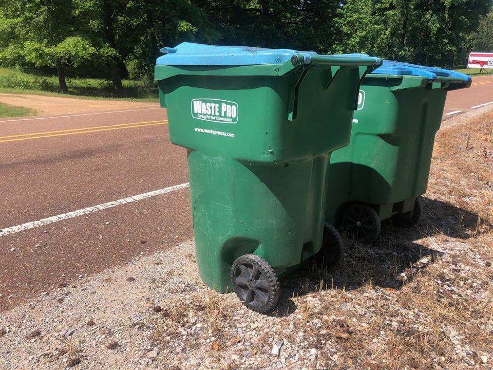 <strong>Waste Pro carts sit outside a house in Nesbit, Mississippi. On Monday, DeSoto County supervisors approved a new contract with Waste Connections for garbage and recycling collection.</strong> (Beth Sullivan/The Daily Memphian)