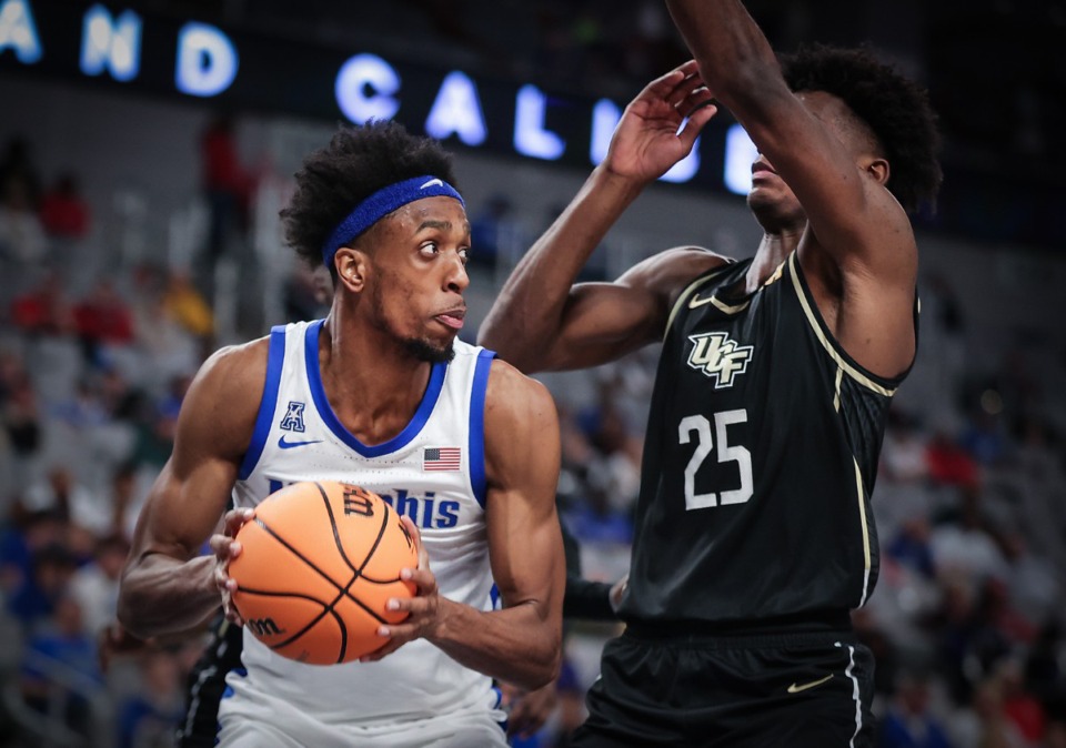 <strong>Memphis forward DeAndre Williams (12) powers to the basket during March 10, 2023 game against UCF.</strong> (Patrick Lantrip/The Daily Memphian file)