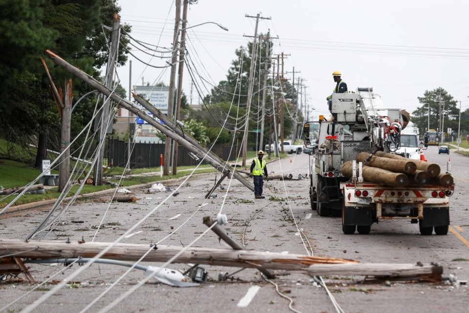<strong>Memphis, Light, Gas and Water crews work to restore power to several downed electrical lines on Winchester Avenue near Ross Road on Wednesday, July 19, 2023.</strong> (Mark Weber/The Daily Memphian)