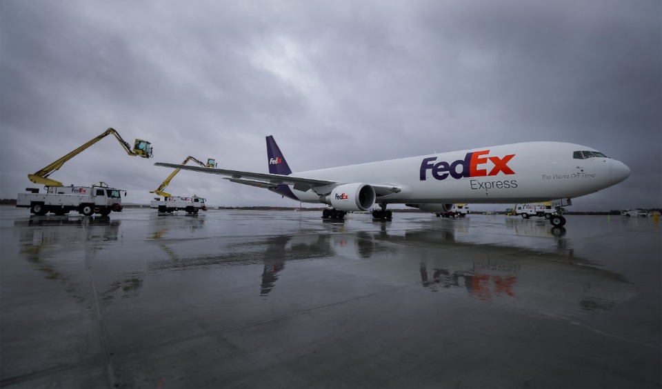 <strong>De-icing trucks surround a FedEx plane parked at the Memphis International Airport while awaiting the arrival of Secretary of Transportation Pete Buttigieg Nov. 29, 2022.</strong> (Patrick Lantrip/The Daily Memphian file)
