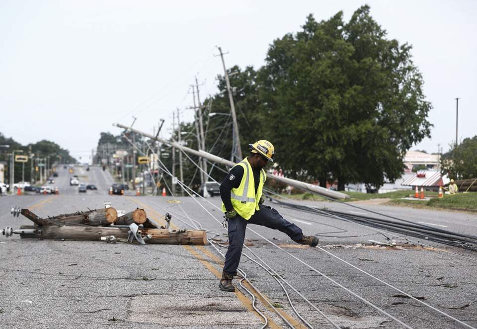 <strong>Memphis Light, Gas and Water crews work to restore power to several downed electrical lines on Winchester Road near Ross Road on Wednesday, July 19, 2023.</strong> (Mark Weber/The Daily Memphian)
