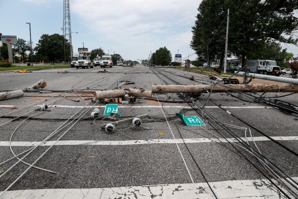 <strong>Memphis Light, Gas and Water crews work to restore power to several downed electrical lines on Winchester Road near Ross Road on Wednesday, July 19, 2023.</strong> (Mark Weber/The Daily Memphian)