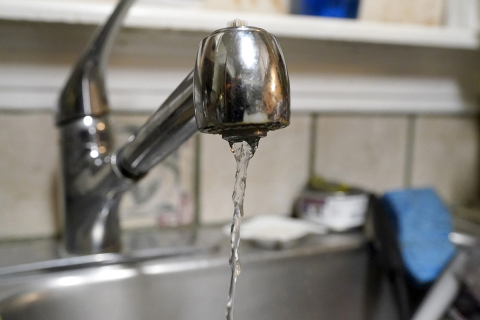 <strong>Water pours slowly out of a faucet.&nbsp;<span class="s1">Germantown said it discovered a generator powering a water plant&nbsp;was leaking following a power outage from a Tuesday storm.</span></strong> (Tony Gutierrez/AP file)