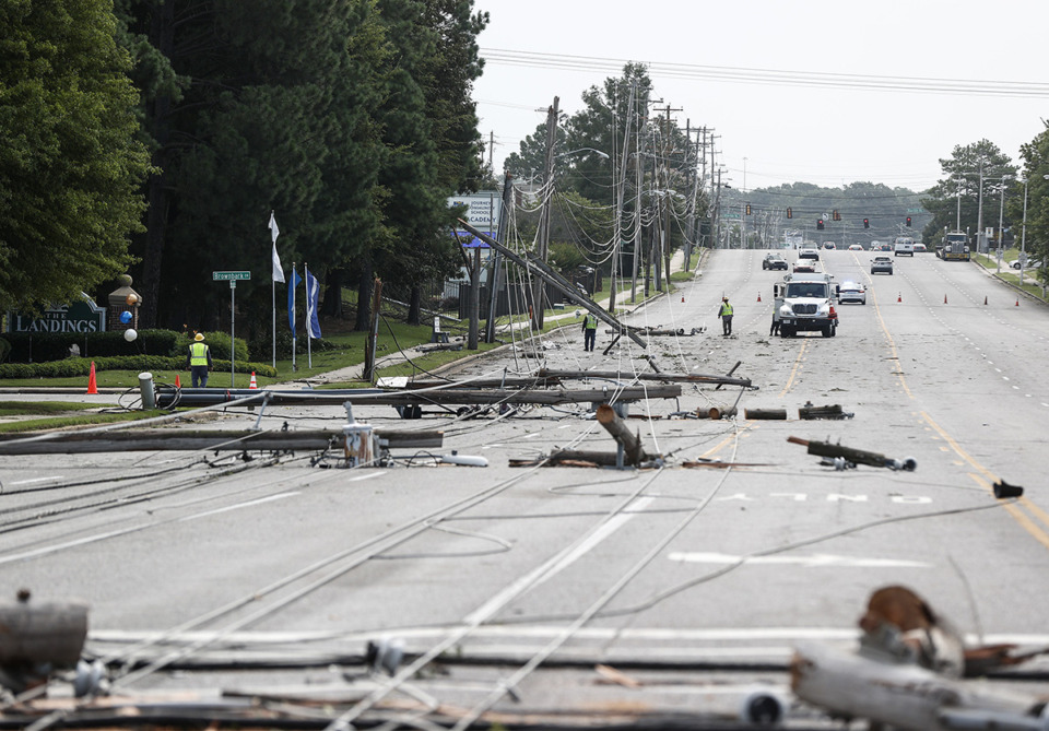 <strong>Memphis Light, Gas and Water crews work to restore power to several downed electrical lines on Winchester Road near Ross Road Wednesday, July 19.</strong> (Mark Weber/The Daily Memphian)