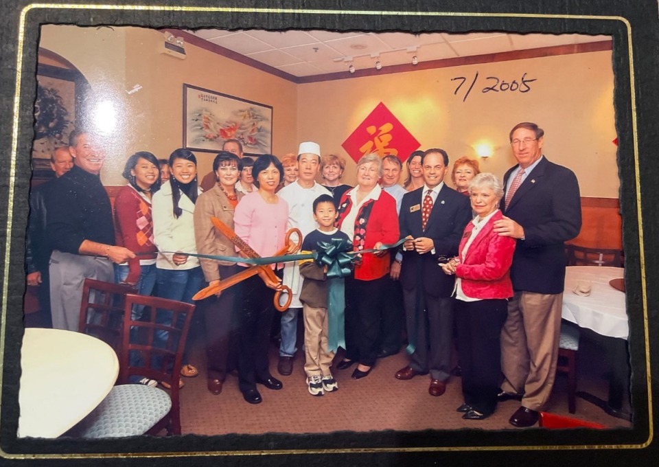 <strong>Then-mayor Sharon Goldsworthy (red jacket) stood beside Yong Hu during a 2005 ribbon-cutting ceremony at New Asia in Germantown.</strong> (Courtesy Hu Family)