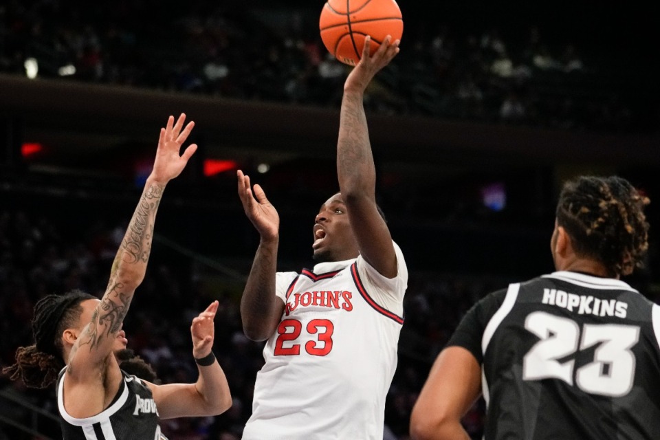 <strong>St. John's forward David Jones (23) shoots the ball during the second half of an NCAA college basketball game against Providence, Saturday, Feb 11, 2023 in New York.</strong> (AP Photo/Bryan Woolston)