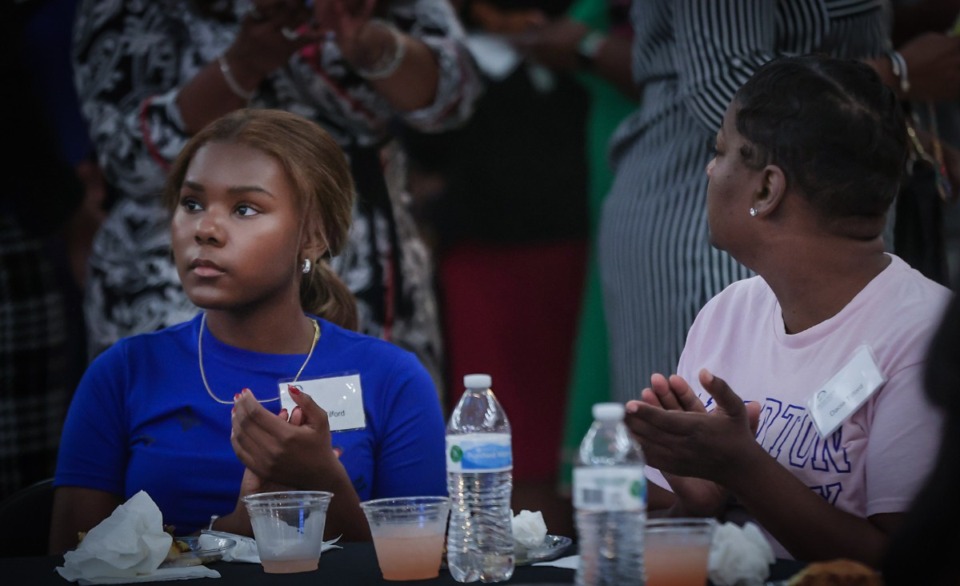 <strong>Kristen Tillford and her mother, Dacia Tillford, applaud during the HBCU ceremony at Memphis City Hall Aug. 2, 2023.</strong> (Patrick Lantrip/The Daily Memphian)