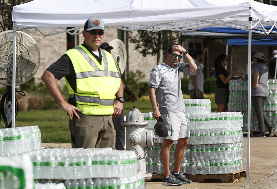 <strong>A local attorney is suing the City of Germantown for failing to fulfill his records request regarding the diesel spill on July 19 at the Southern Avenue water treatment plant. The City handed out water to residents on Monday, July 24, 2023 at Forest Hill Elementary School.</strong> (Mark Weber/The Daily Memphian)