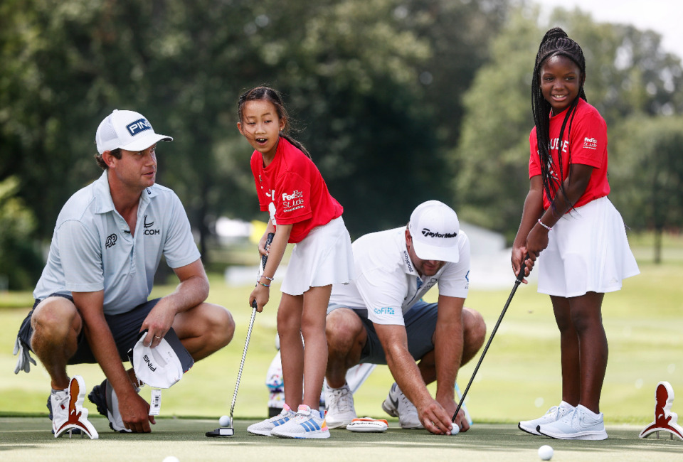 <strong>Children's Research Hospital patients Maelin-Kate (middle, left) and Azalea (right) PGA players Harrison English (left) and Taylor Montgomery (middle right) on Tuesday, Aug. 8.</strong> (Mark Weber/The Daily Memphian)