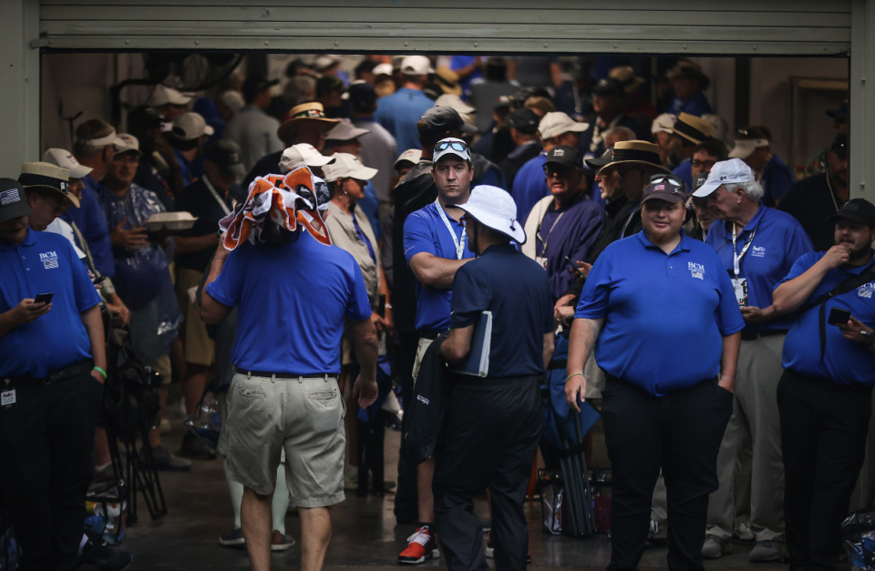 <strong>Dozens of people take shelter under the clubhouse during a rain delay at the FedEx St. Jude Championship at TPC Southwind on Aug. 9, 2023.</strong> (Patrick Lantrip/The Daily Memphian)