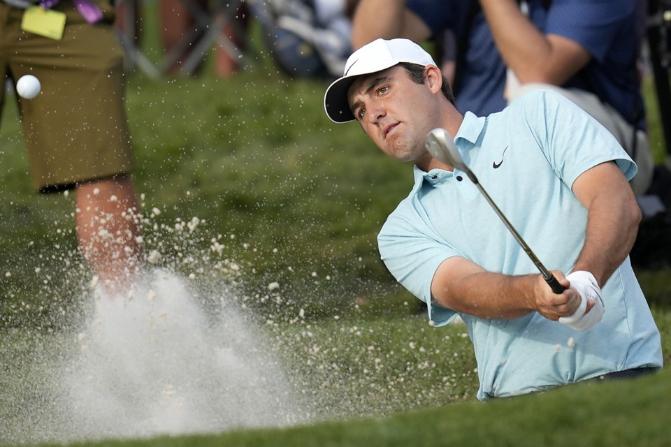 <strong>Scottie Scheffler hits from a bunker toward the 16th green during the final round of The Players Championship golf tournament, Sunday, March 12, 2023, in Ponte Vedra Beach, Fla. He won the Championship by five strokes.</strong> (Charlie Neibergall/AP Photo file)