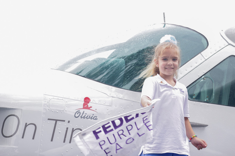 <strong>St. Jude patient Oliva unveils a FedEx feeder plane named in her honor at the FedEx St. Jude Championship at TPC Southwind on Aug. 9, 2023.</strong> (Patrick Lantrip/The Daily Memphian)