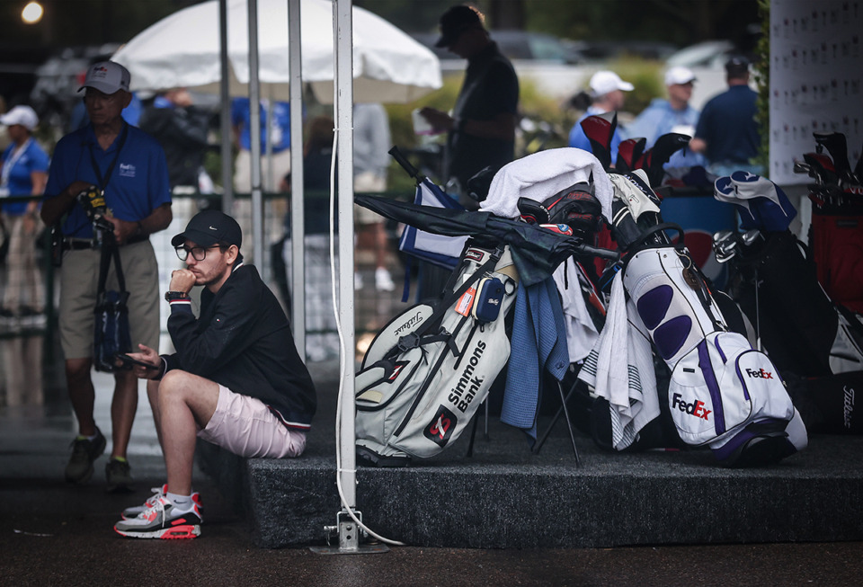 <strong>Workers wait under a canopy during at rain delay at the FedEx St. Jude Championship at TPC Southwind Aug. 9.</strong> (Patrick Lantrip/The Daily Memphian)
