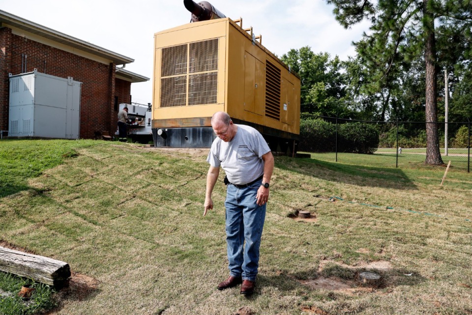 <strong>Bo Mills, Germantown&rsquo;s director of public works, shows the path of leaked diesel fuel that seeped through the ground into water treatment plant pipe during a tour on Friday, August 11, 2023.</strong> (Mark Weber/The Daily Memphian)
