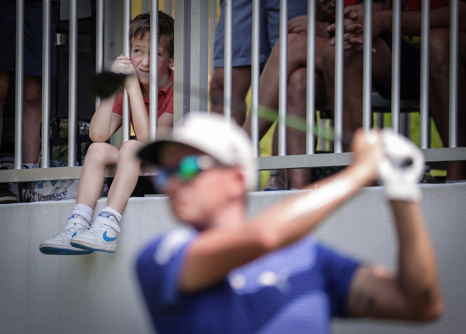 <strong>A young fan watches Rickie Fowler tee off on the second day of the FedEx St. Jude Championship at TPC Southwind Aug. 11.</strong> (Patrick Lantrip/The Daily Memphian)