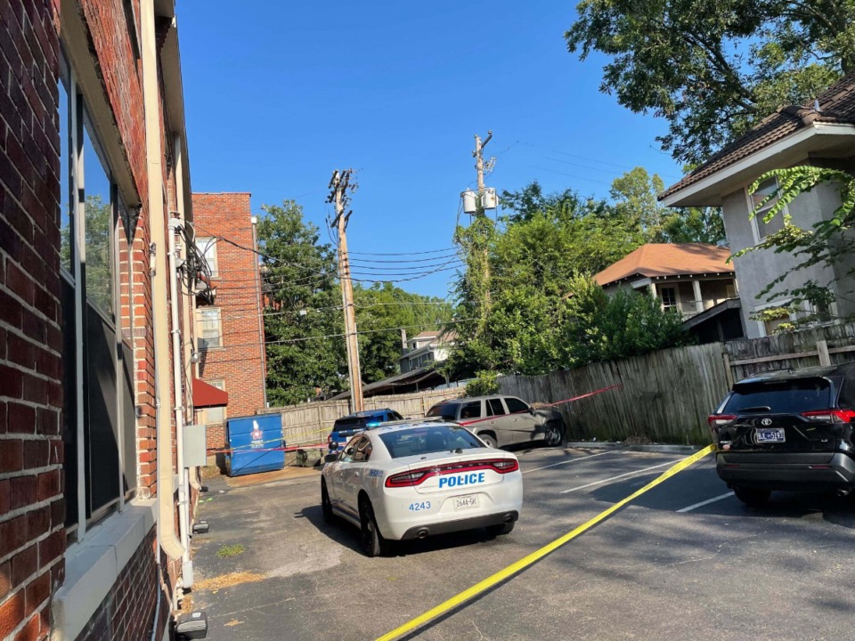 <strong>Crime scene tape ropes off a Memphis Police Department squad car at a Midtown apartment complex Aug. 11. A man was detained by police shortly after noon and placed in the blue squad car in front of the white one. He was later removed from the scene in an ambulance.</strong> (Samuel Hardiman/The Daily Memphian)