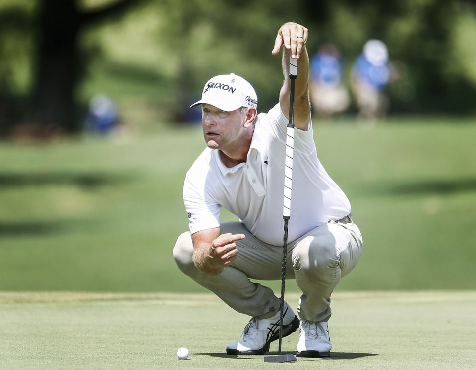 <strong>PGA golfer Lucas Glover lines up a putt during the final round of the FedEx St. Jude Championship on Sunday, Aug. 13. Glover won the title,</strong>&nbsp;<strong>securing his second straight tournament victory and vaulting himself into the top three of the FedEx Cup point standings.</strong> (Mark Weber/The Daily Memphian)
