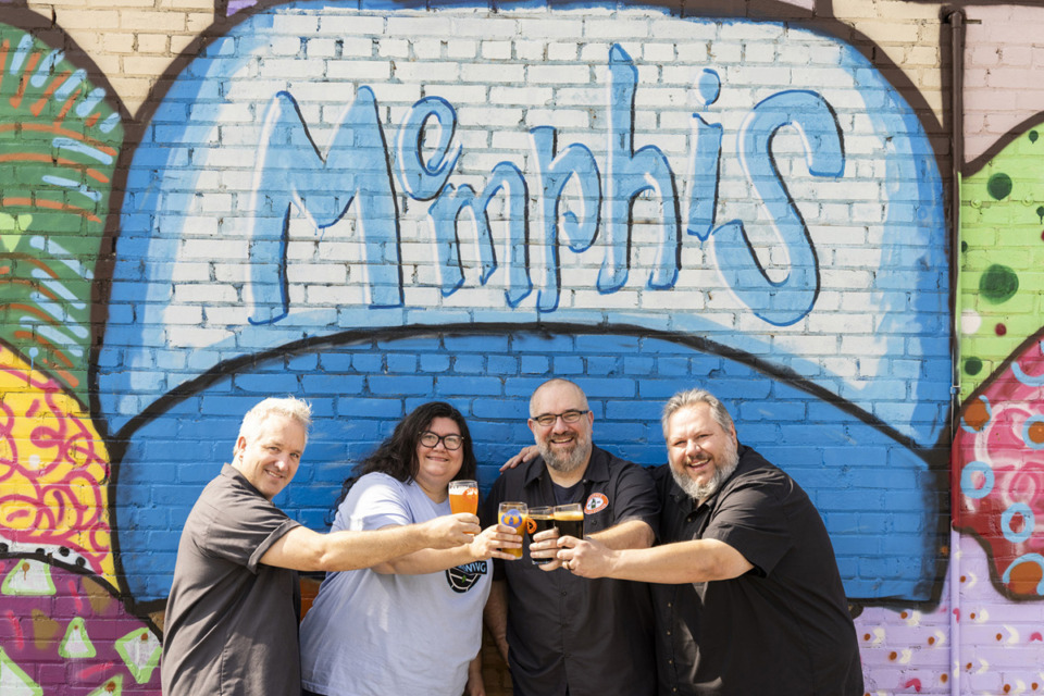 <strong>Co-owners of Memphis Filling Station (from left) Scott Kley, Heather Reed, Bryan Berretta and Blake Marcum pose in front of the murals off Front Street behind Soul and Spirits Brewery. They plan to open a new brewery in Midtown.</strong> (Brad Vest/Special to The Daily Memphian)