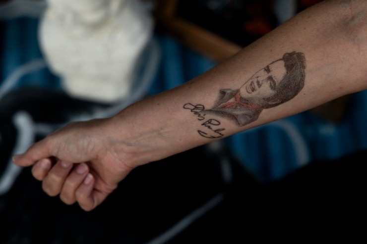 <strong>A fan shows off his Elvis tattoo at the Candlelight Vigil Aug. 15.</strong>&nbsp;(Brad Vest/Special to The Daily Memphian)