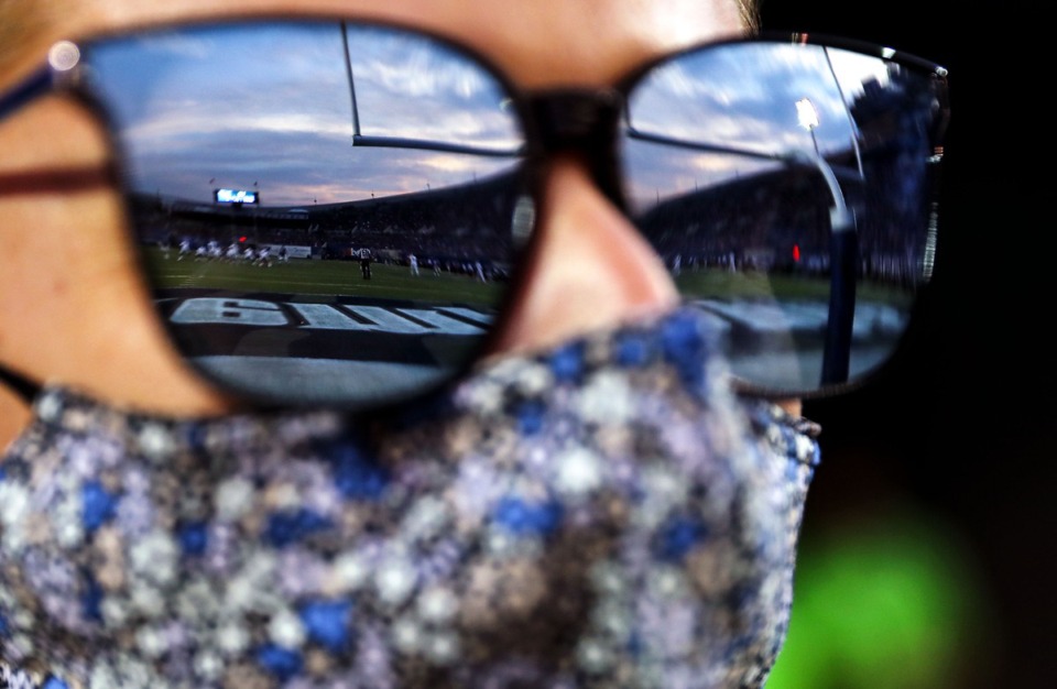 <strong>Jenny Pallme watches the University of Memphis play Nicholls State as the sun sets over the Liberty Bowl Sept. 4, 2021.</strong> (Patrick Lantrip/The Daily Memphian file)