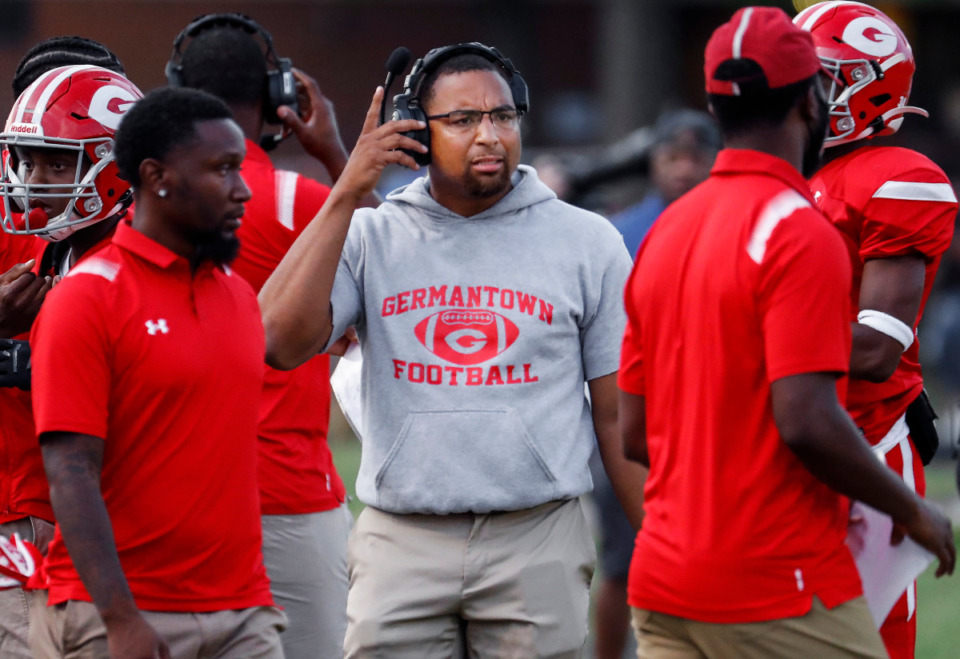<strong>Germantown head coach Gene Robinson (middle) has his Red Devil football team on top of the Dandy Dozen.</strong> (Mark Weber/The Daily Memphian file)