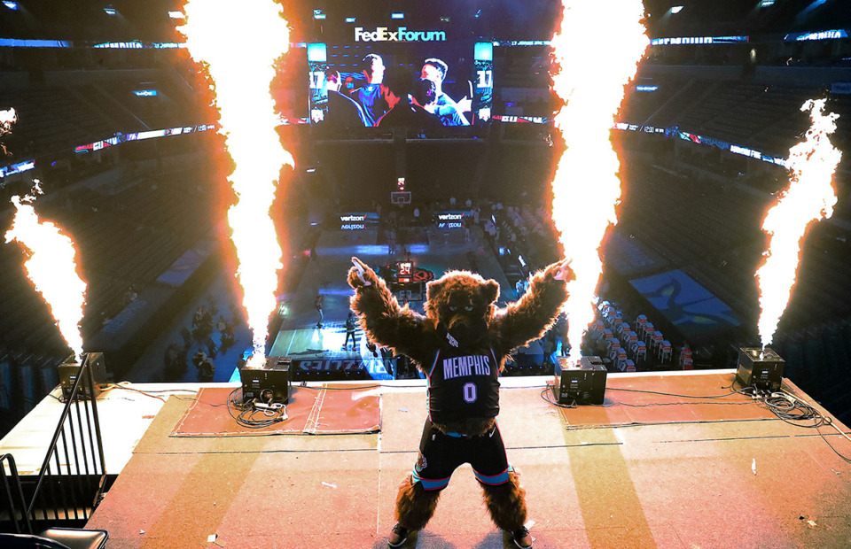 <strong>Grizz, the Memphis Grizzlies mascot, poses in front of pyrotechnics before a Jan. 3, 2021 game against the Los Angeles Lakers.</strong> (Patrick Lantrip/The Daily Memphian file)