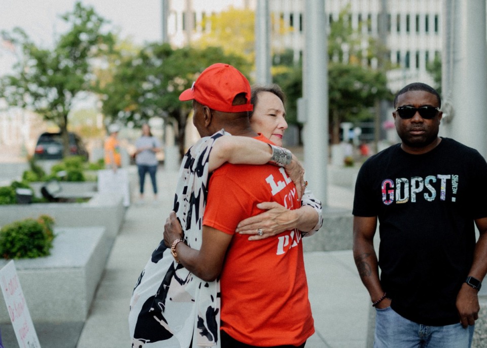 <strong>Patty Crawford hugs Stevie Moore of&nbsp;Freedom From Unnecessary Negatives prior to a Downtown rally for gun control. A small group gathered Aug. 19 to hear city leaders speak on the lack of gun control and what they want to see done in Tennessee.</strong> (Houston Cofield/Special to The Daily Memphian)