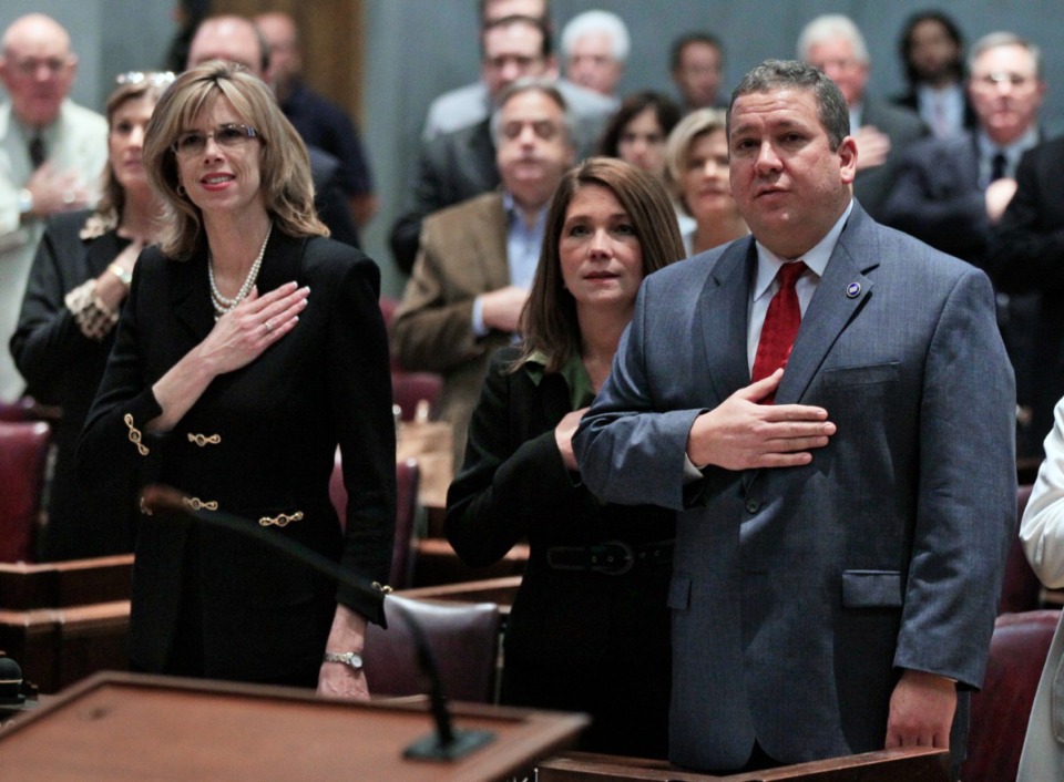 <strong>Rep. Debra Maggart (left, R-Hendersonville) said the Pledge of Allegiance on the opening day of the second session of the 107th General Assembly on Jan. 10, 2012, in Nashville.</strong>&nbsp;<strong>A few months later she came under attack after voicing concerns about a &ldquo;guns in trunks&rdquo; bill and lost her position.</strong> (Mark Humphrey/AP file)