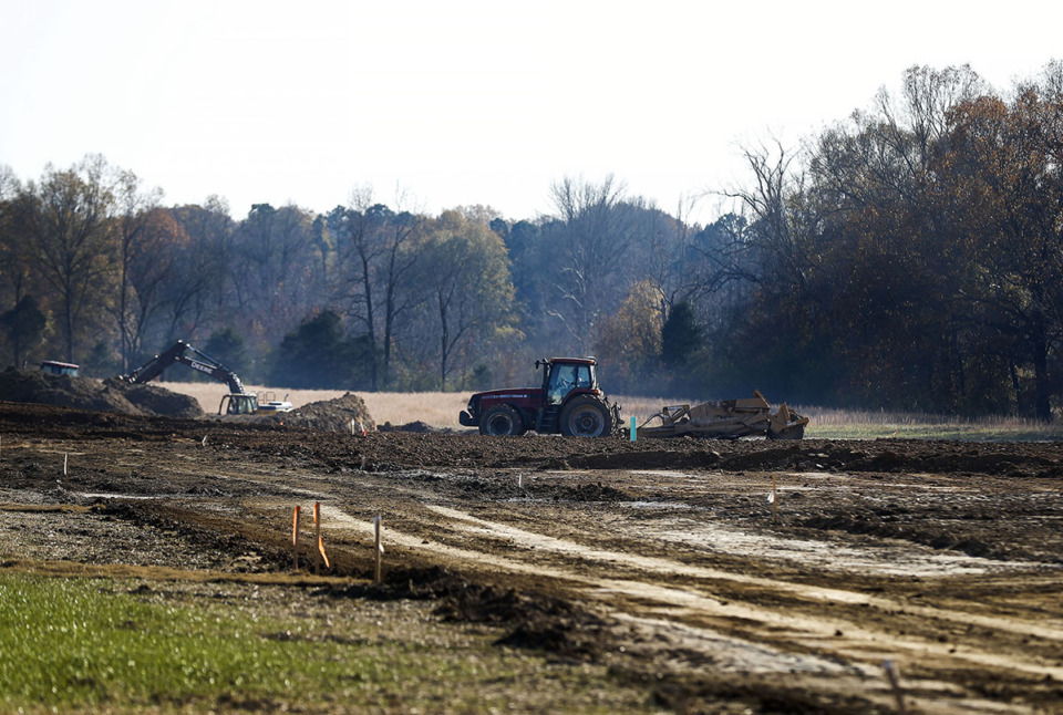 <strong>A heavy equipment operator levels land as construction begins on the Lakeland Meadows subdivision in December 2020 in Lakeland. Valleybrook Development bought the development from the previous developers and gained approval for two residential development contracts.</strong> (Mark Weber/The Daily Memphian file)