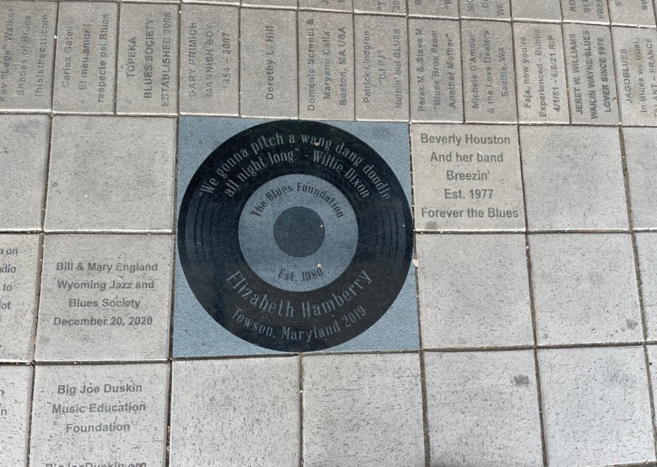 <strong>A memorial landscape in front of The Blues Foundation, 241 S. Main Street, displays engraved paver stones on the sidewalk interspersed with blues lyrics.</strong> (Jane Roberts/The Daily Memphian)