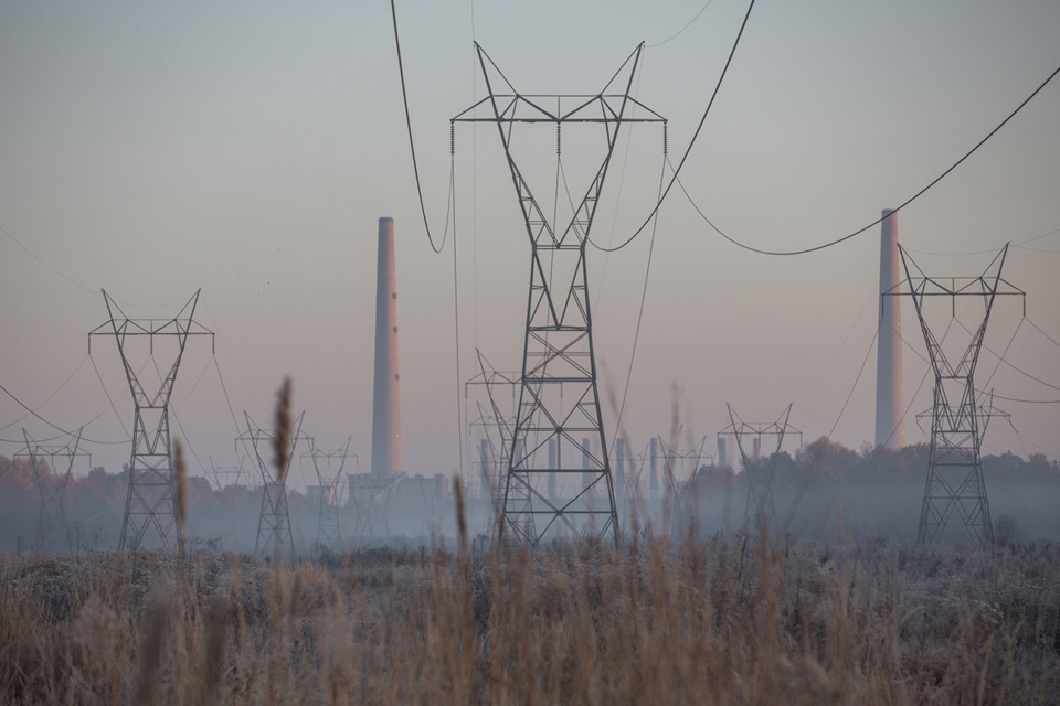 <strong>Transmission lines and cooling towers at the TVA Shawnee Power Plant in West Paducah, Ky., are illuminated by the rising sun Nov. 14, 2017.</strong> (Ryan Hermens/The Paducah Sun via AP file)