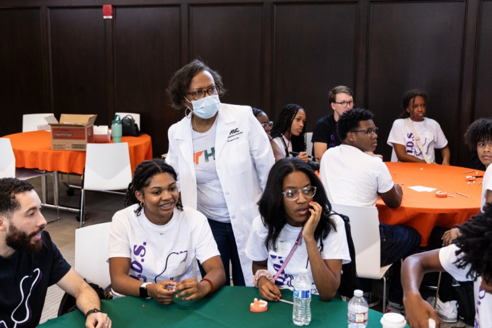 <strong>Dr. Layne Levy works with young people during the Determined to Be a Doctor Someday symposium Aug. 19 at UTHSC.</strong> (Brad Vest/Special to The Daily Memphian)