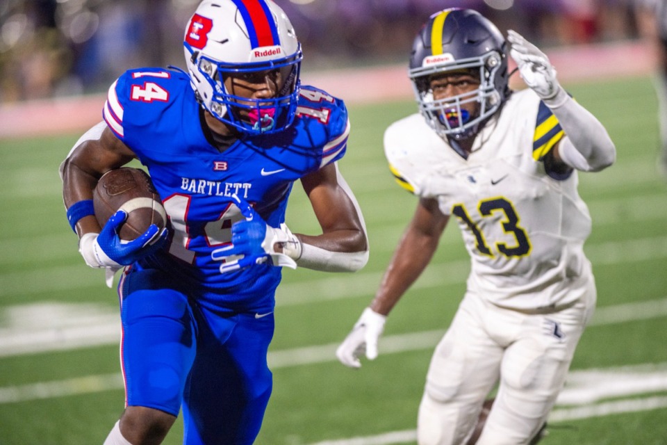 <strong>Bartlett receiver Malachi Butler dashes to the goal line with Lausanne defensive back Jawell Rodgers in pursuit during Friday's game at Bartlett High School, Friday, Aug. 25, 2023. Bartlett defeated Lausanne 24-14.</strong> (Greg Campbell/Special to The Daily Memphian)