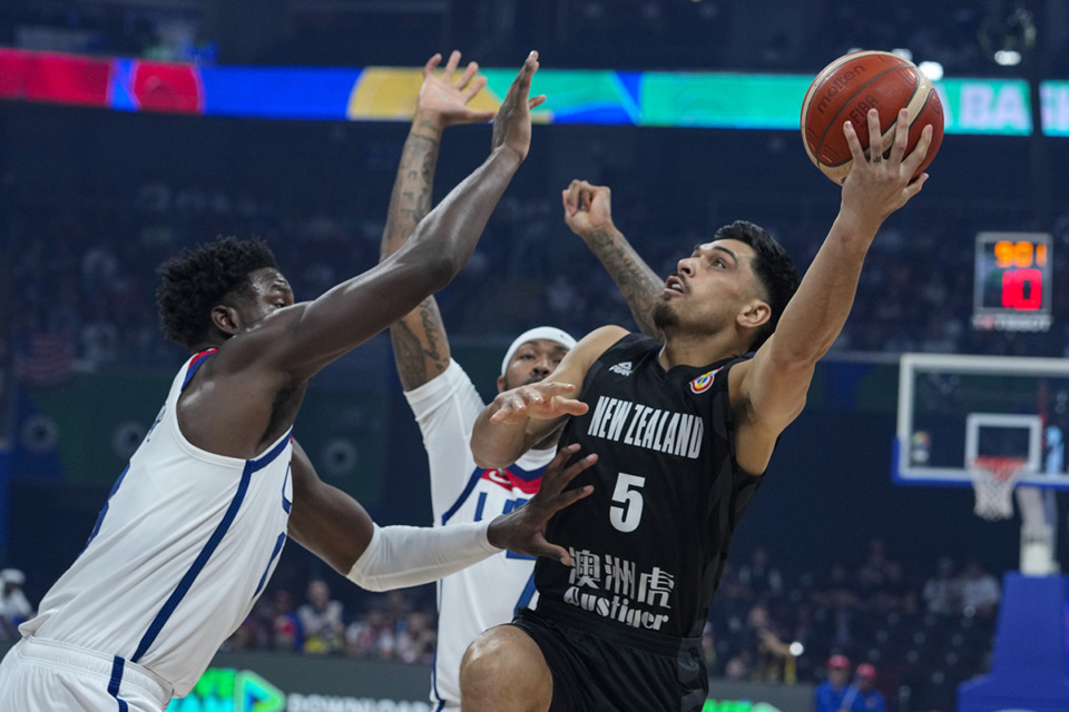 <strong>New Zealand guard Shea Ili (5) shoots over U.S. forward Jaren Jackson Jr. (13) during the first half of a Basketball World Cup group C match in Manila, Phillipines, Aug. 26.</strong> (Michael Conroy/AP file)
